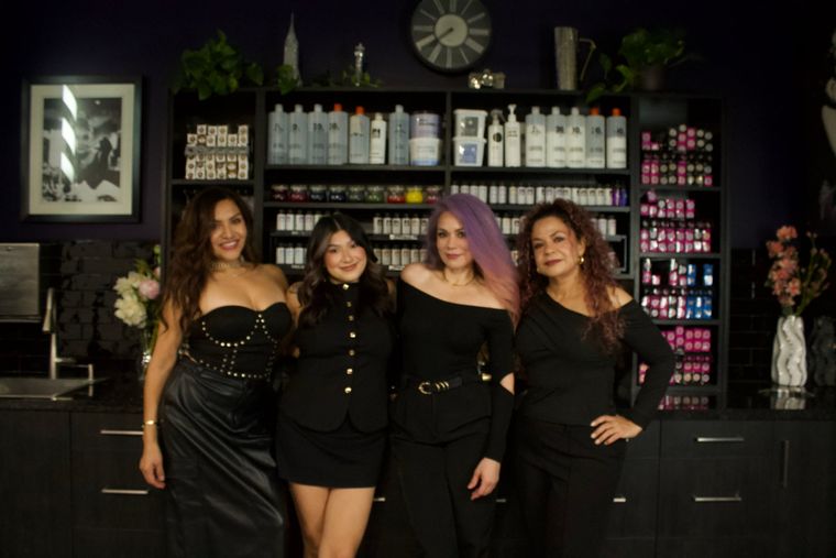 The Revolver Hair Studio team of four in front of the colour wall, Judith Pulido third from the left